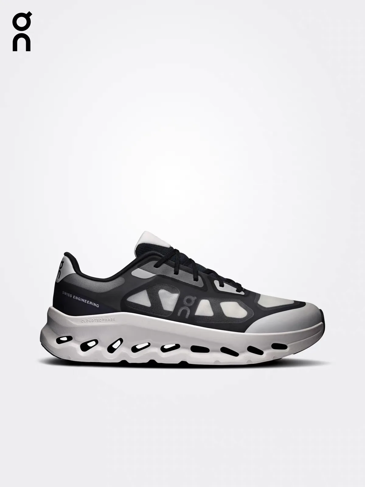 Black and grey max-cushion cloud running shoe with chunky sole, side view