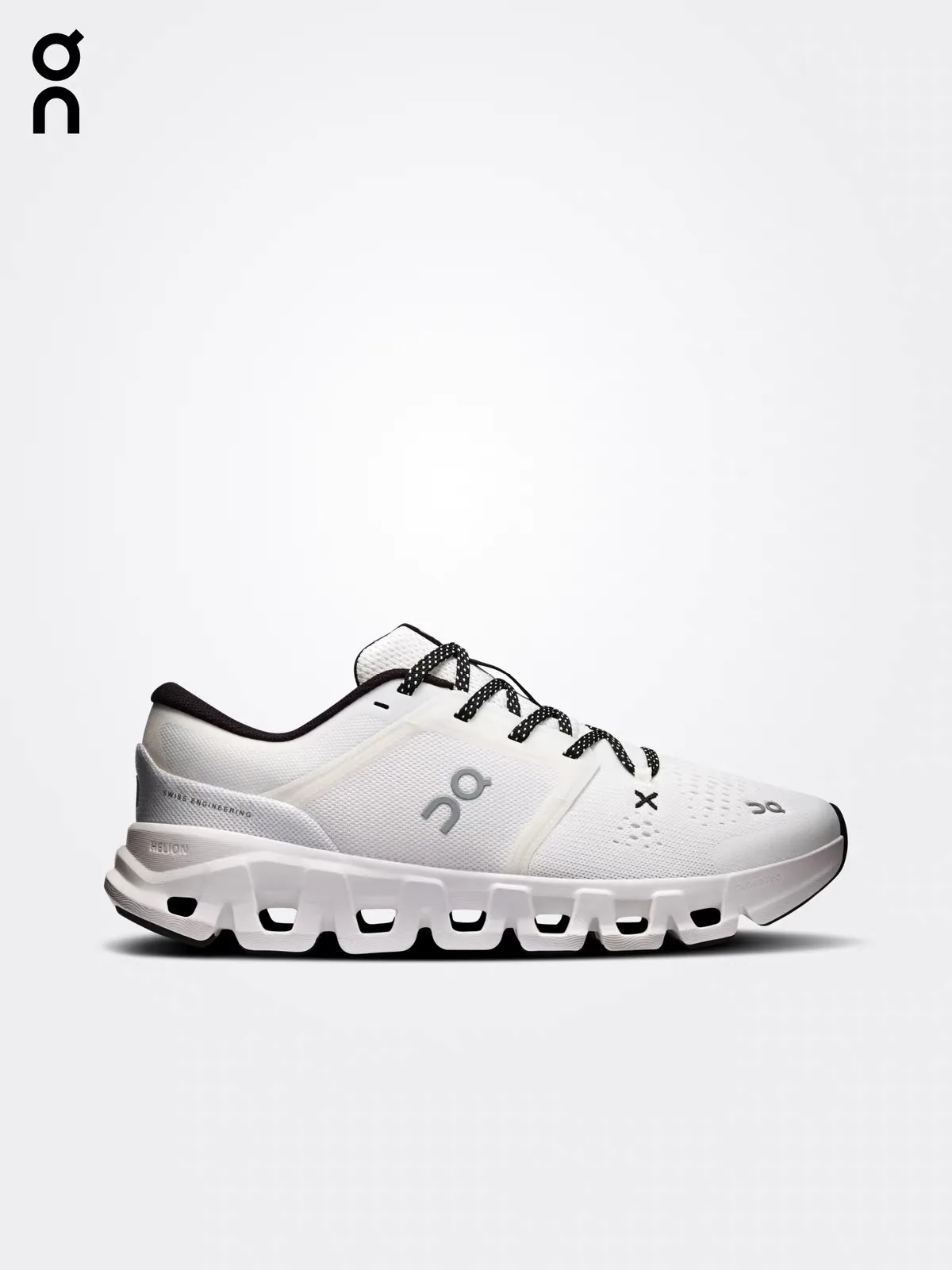 Cloud X white cross-training shoe with black laces, side view